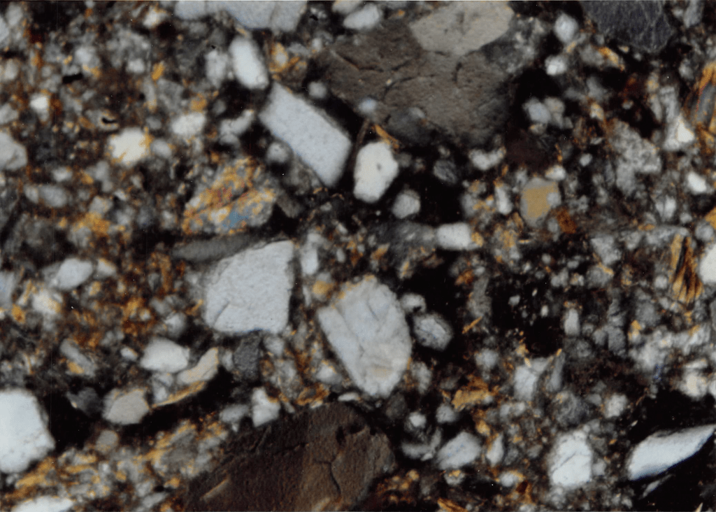 Soil from "C" horizon lacking cutans coating grains.